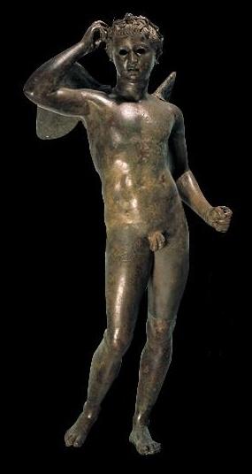 Statuetta in bronzo di giovanetto alato con in testa una corona di olivo, forse Eros o Agone