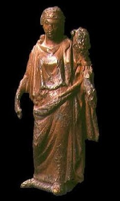 Statuetta in bronzo che raffigura Cerere. La dea, che  ingentilita da un diadema, tiene in mano il corno della abbondanza da dove fuoriescono numerosi frutti. Attualmente  al Museo del Bardo