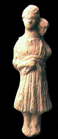 Statuetta che raffigura una donna, forse una madre, che porta un bambino sulle spalle. Datazione incerta. Attualmente  al Museo del Bardo.