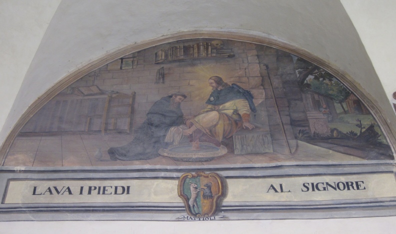 Agostino lava i piedi al Cristo pellegrino, lunetta nel chiostro del convento agostiniano di Cortona