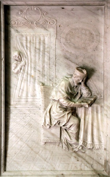 Agostino vescovo nello studio in un bassorilievo a Monselice