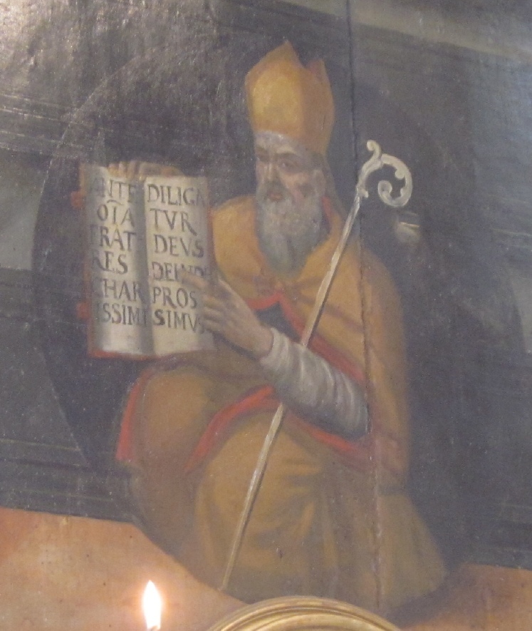 Particolare della pala dove Agostino mostra l'incipit della sua Regola dipinto del primo Cinquecento