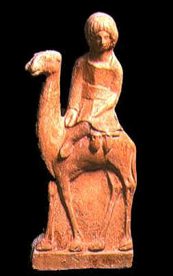 Statuetta in terracotta che raffigura un libico (berbero) che cavalca un dromedario