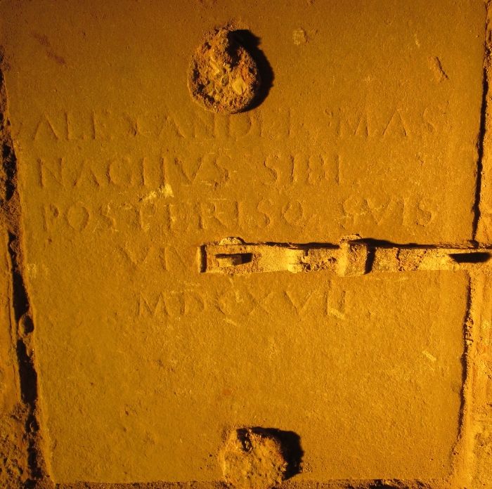Lapide della chiesa medioevale che ricorda Alessandro Masnagha