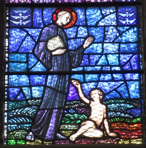 Agostino incontra un bimbo sulla spiaggia: vetrata della chiesa agostiniana di Dublino con scene agostiniane