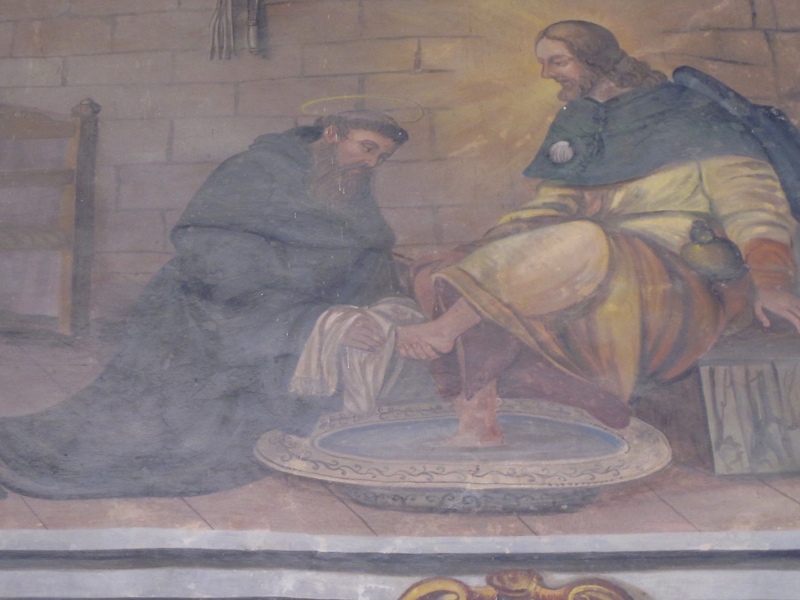 Agostino lava i piedi al Cristo pellegrino, lunetta nel chiostro del convento agostiniano di Cortona