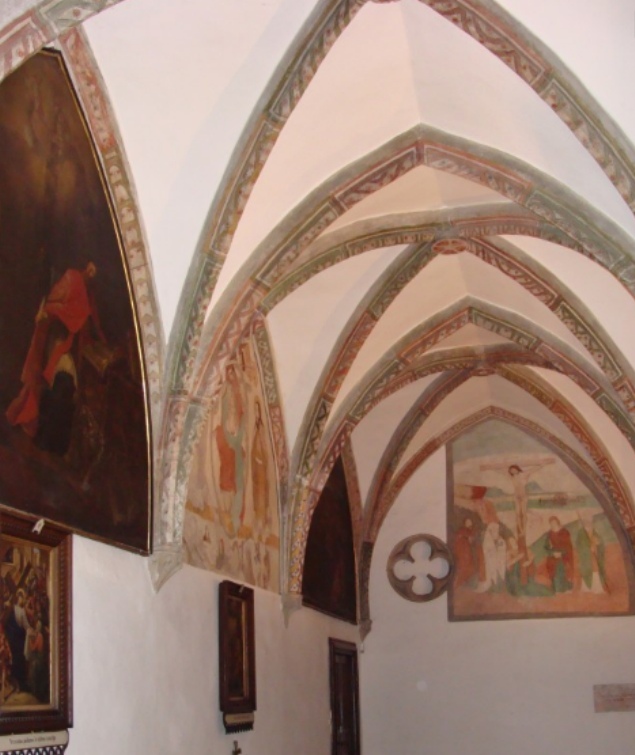 A sinistra la lunetta con Agostino che scrive della Trinità