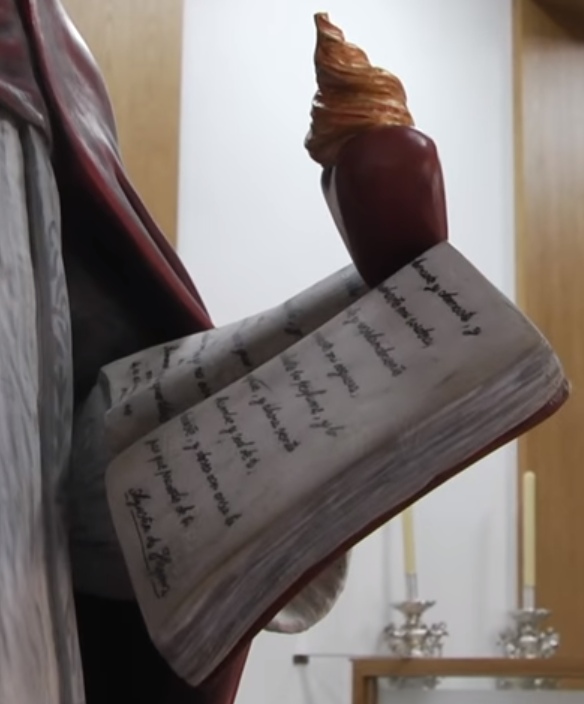 Agostino vescovo e Dottore della Chiesa: particolare delle scritte sul libro