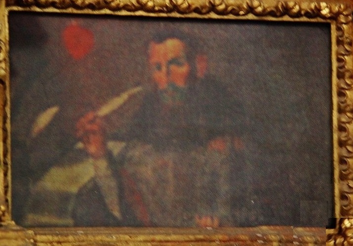 Agostino scrive allo scrittoio nel suo studio